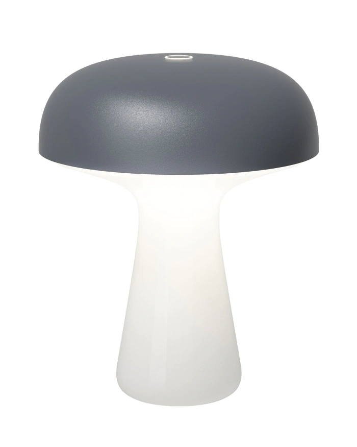 Lampe de table moderne en forme de champignon, avec un plateau gris foncé mat et une base blanche lisse qui émet de la lumière.