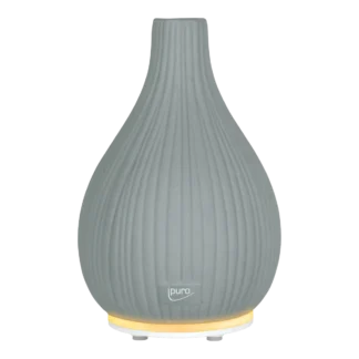 Le Diffuseur AIR SONIC Vase est un diffuseur d'arômes gris en forme de goutte d'eau avec des stries verticales, un logo "ipuro" subtil sur le devant et une lumière jaune chaude à la base.