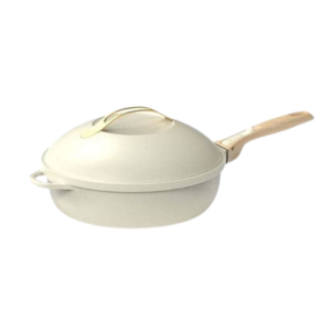 La Poêle Fabuleuse 28 cm est une poêle antiadhésive beige avec un couvercle bombé assorti et un manche en bois clair, sur fond blanc.