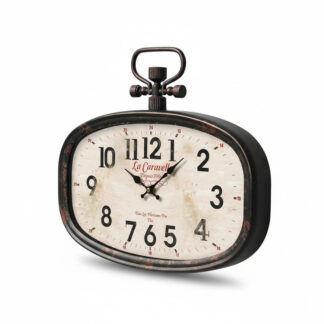 L'Horloge Caravelle Murale est une horloge de table ovale de style vintage avec un cadre noir, un cadran blanc, des chiffres noirs, une clé de remontage décorative sur le dessus, un cadran légèrement vieilli indiquant 10:10, et "La Caravelle" écrit en rouge.