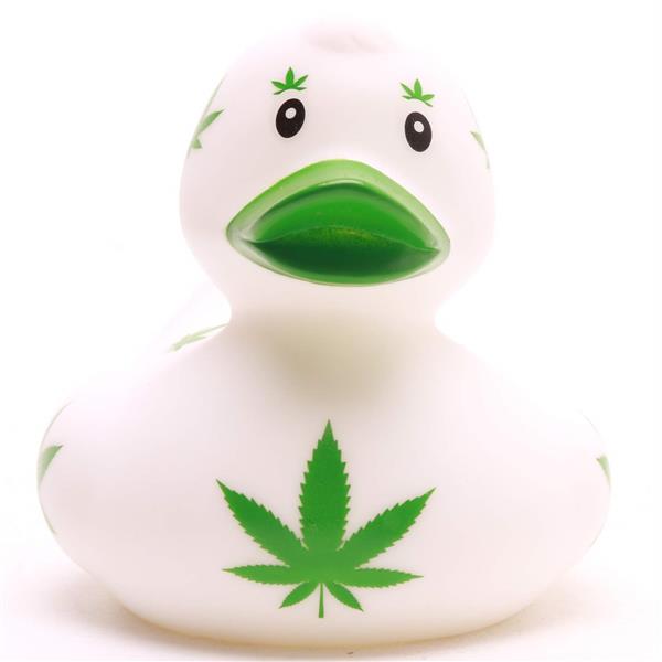 Un canard de bain « Baby Garçon » au corps blanc, orné de motifs représentant des feuilles de cannabis vertes sur le bec, au-dessus des yeux et sur tout le corps.
