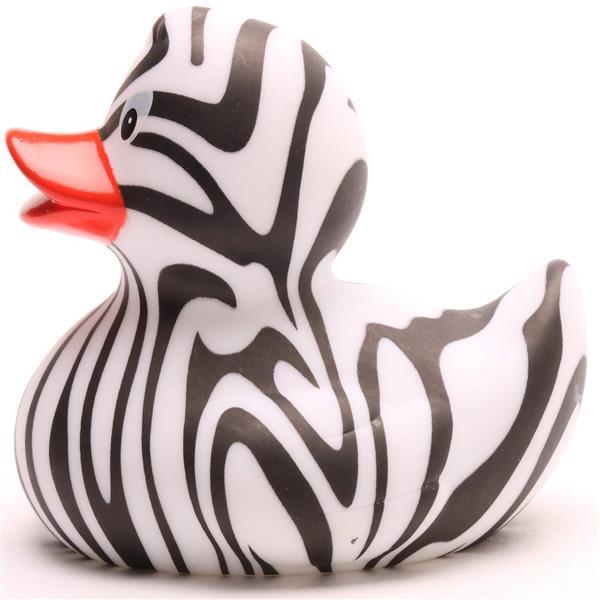 Un canard en caoutchouc aux rayures zébrées noires et blanches et au bec orange, représenté de profil sur fond blanc.