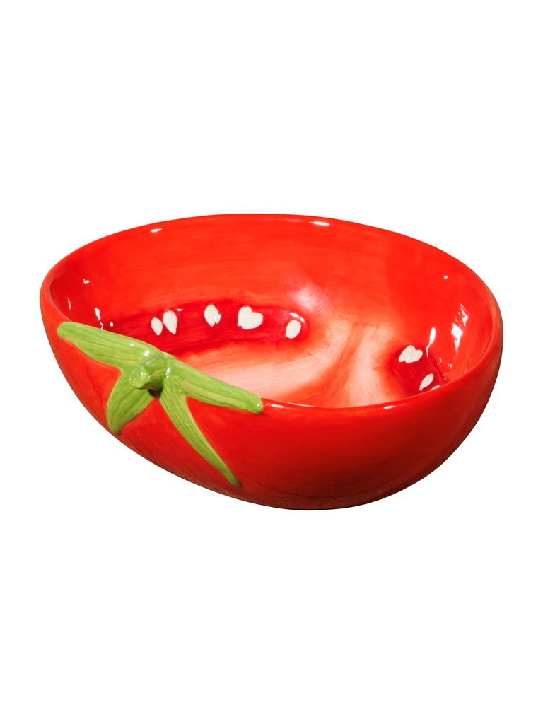 Petit saladier en dolomite rouge et verte, en forme de tomate, orné d’une petite queue verte à l’extérieur et d’un motif de graines blanches à l’intérieur.
