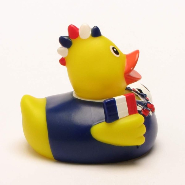 Un canard de bain « Fan de football France » : un canard en caoutchouc jaune portant un maillot bleu et un écusson rouge, blanc et bleu représentant un coq, tenant un petit drapeau français.